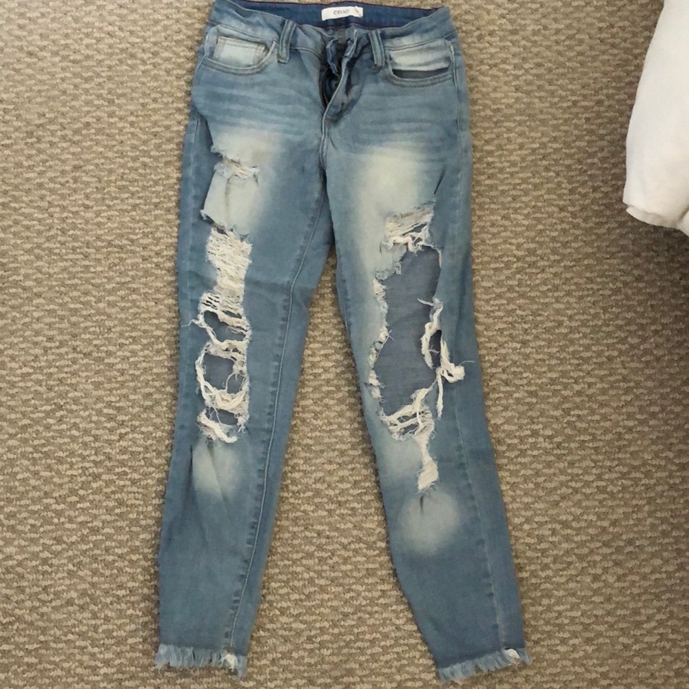 Distressed light denim jeans